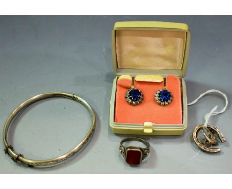 An Arts and Crafts silver and carnelian set ring; a silver bangle; a silver brooch, as a bluebird and horseshoe; earrings (4)