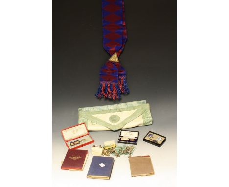 Masonic Interest - a 9ct gold Masonic jewel, boxed; a silver badge; apron, sash; etc