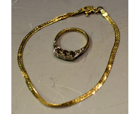 An 18ct gold bracelet; an illusion set three stone diamond ring, marks rubbed, 5.4g gross (2)