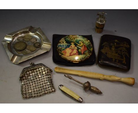 A silver ash tray; a Japanese cigarette case; a white metal bottle stopper, surmounted with Don Quixote figure; a Stratton co