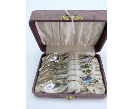 A set of six silver and enamelled coffee spoons, each stamped sterling, 1.2ozt, casedEach with damage and/or losses to the en