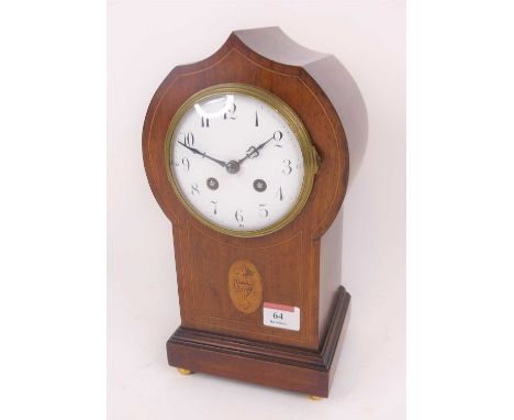 An Edwardian boxwood strung mantel clock, the enamel dial showing Arabic numerals, having an eight day movement striking on a