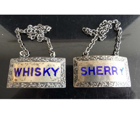A pair of modern silver decanter collars, annotated in blue enamel for Whisky and Sherry, on chains, gross weight 41g, w.5cm 