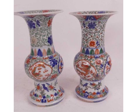 A pair of Chinese porcelain vases, each having a flared rim to cylindrical neck and bulbous body, enamel and underglaze decor