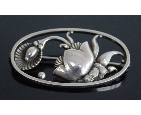 A 1940's Georg Jensen sterling silver floral brooch by Gundorph Albertus, comprising a stylised flower in an openwork surroun