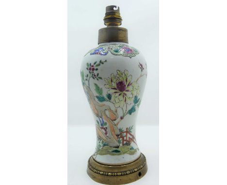 A Chinese famille rose porcelain vase, enamel decorated with flowers, having later brass mounts, converted to a table lamp, h
