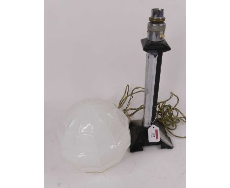 An Art Deco style milk glass light shade, of segmented globular form, height 18cm, together with an Art Deco style table lamp