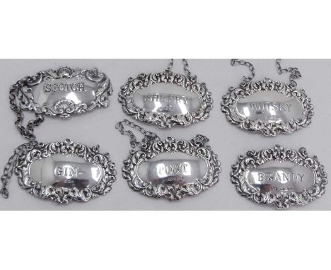 A matched set of Elizabeth II silver decanter labels, inscribed for Gin, Scotch, Whisky, Sherry, Brandy and Port, 2.4ozt 
