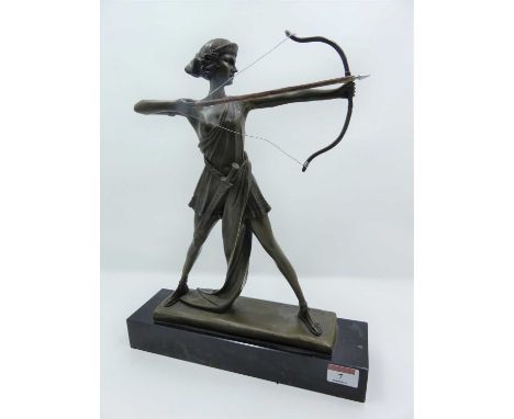 An Art Deco style bronzed metal figure of an archer, mounted upon a black polished hardstone plinth, height 35cm