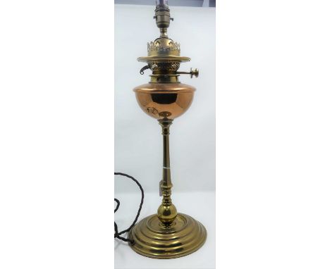 A late 19th century brass and copper oil lamp, converted for electricity, height 53cm including fittings