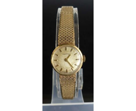 A lady's Certina 14ct gold bracelet watch, having manual wind movement, signed champagne dial, and with hinged deployment cla
