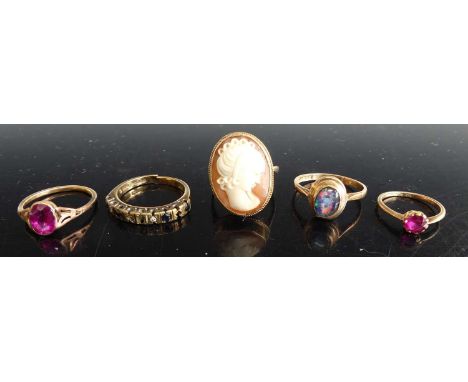 A 9ct gold carved shell cameo ring, size O; together with four other 9ct gold dress rings, to include cabochon opal example, 