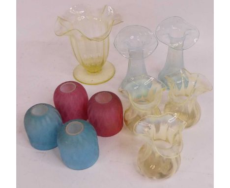 A pair of 19th century blue vaseline glass jack-in-the-pulpit vases, height 13cm, together with a set of three vaseline glass