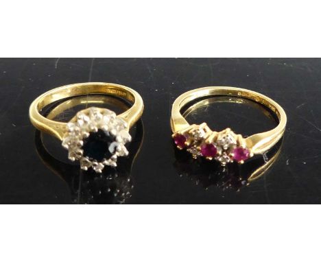 An 18ct gold, sapphire and diamond flower head cluster ring, size L; together with an 18ct gold, ruby and diamond point half 