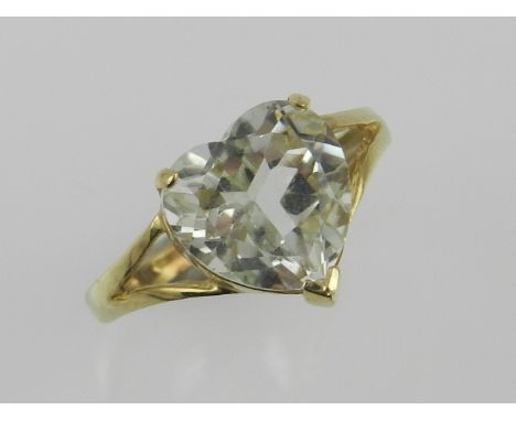 A green amethyst set ring within a 9ct yellow gold band.