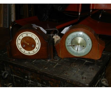 Two oak mantle clocks, marked 'Smiths' to dial, four yellow metal feet.  H.22cm W.30cm, together with one other oak mantle cl