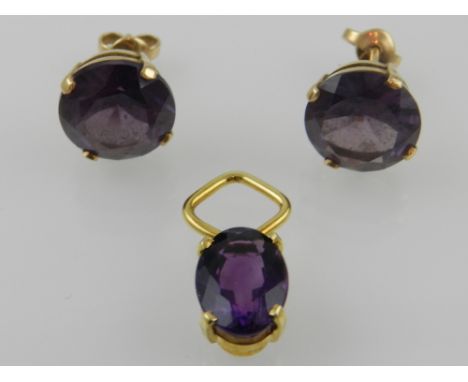 A pair of amethyst earrings on yellow metal mounts, together with a matching amethyst on an 18ct yellow gold pendant mount. 