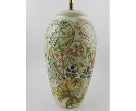 A Moorcroft Pottery table lamp, tube-line decorated with flowers.  H.32cm