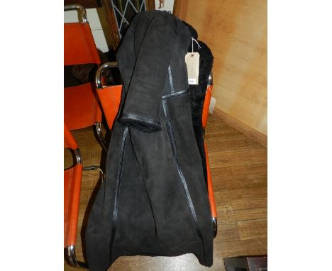 A ladies black sheepskin leather fur coat, the front with buttons, size M,   