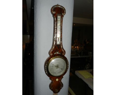 Brooksbank, Bradford. An early Victorian rosewood wheel barometer, mother of pearl inlaid, mounted alchohol thermometer above