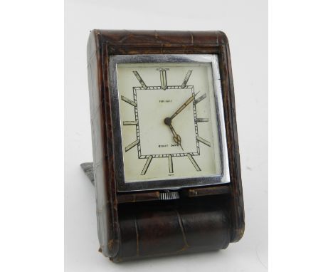 An Art Deco Jaeger LeCoultre crocodile skin travel clock.
