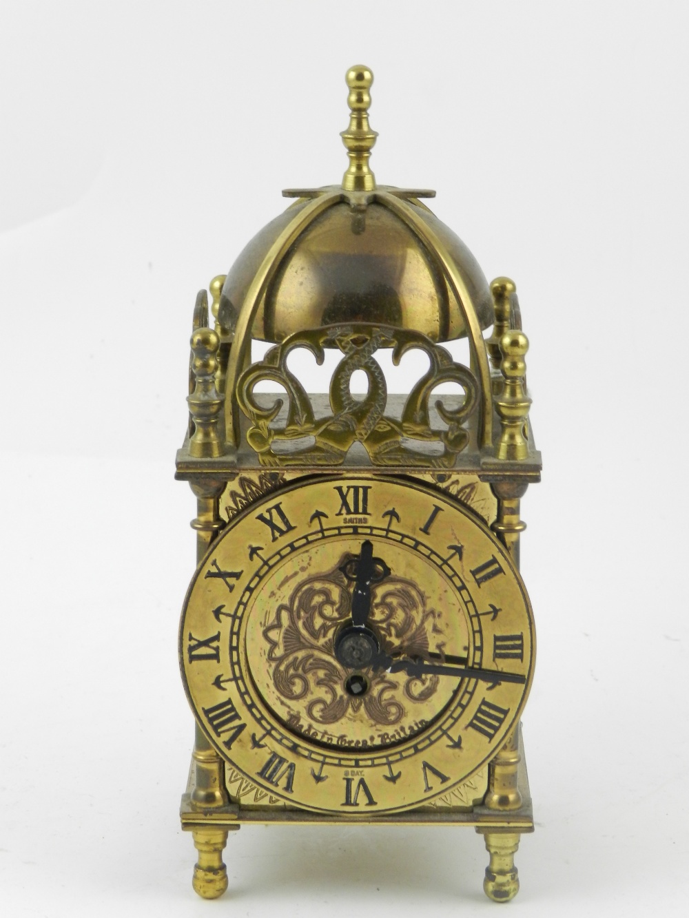 A Smiths brass carriage clock, having domed top and pierced cornice