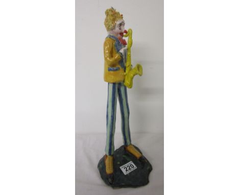 Clown figure playing saxophone