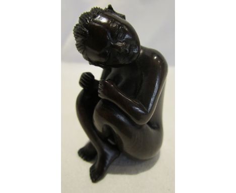 A Japanese hand carved Netsuke figure of a nude Geisha girl. Signed by the artist.