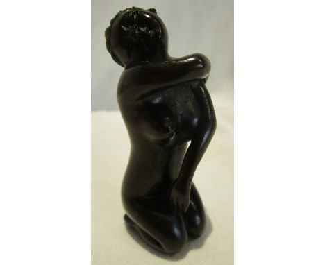A Japanese hand carved Netsuke figure of a nude Geisha girl. Signed by the artist.
