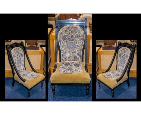 Late Victorian Ebonised Low Chair.  Beaded tapestry back rest and seat, turned front legs, raised on casters.  Please see ima