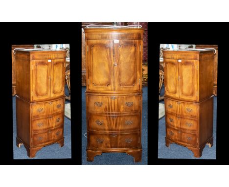 A Modern 20thC Mahogany Bow Fronted Cocktail Cabinet, the top with two shelves and a frieze drawer above three drawers on bra