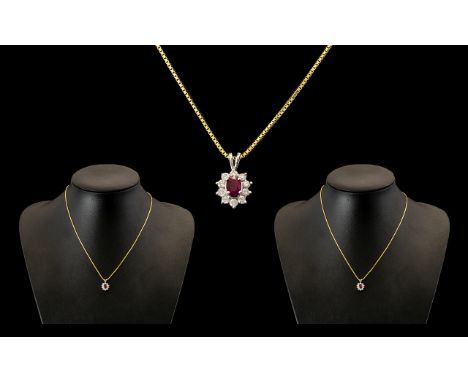 18ct White Gold Attractive Ruby and Diamond Pendant Drop in the form of a flower head attached to a 9ct gold chain. The penda