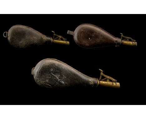  A 19th Century Brass And Leather Powder/Shot Flask. Unmarked, Embossed Leather Depicting A Mounted Soldier Together With Two