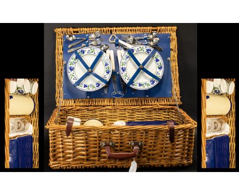 A Wicker Picnic Hamper with four place settings. Fully fitted with flask, plates, cups, cutlery, sandwich boxes etc. Plaque t