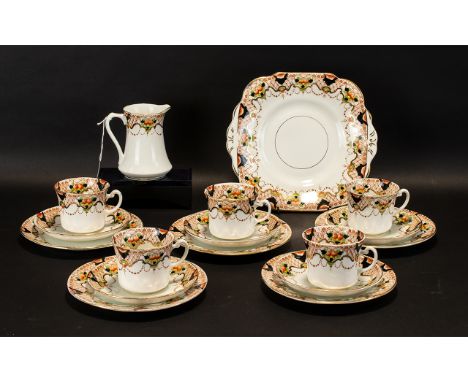 Royal Albert Bone China Tea Service comprising of twelve tea cups, twelve saucers, twelve sandwich/cake plates, a sugar bowl 