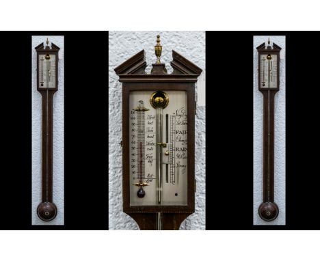 An Edwardian Mahogany Stick Barometer unmarked silvered dial. With string inlay and Chequered banding. Of typical form and me