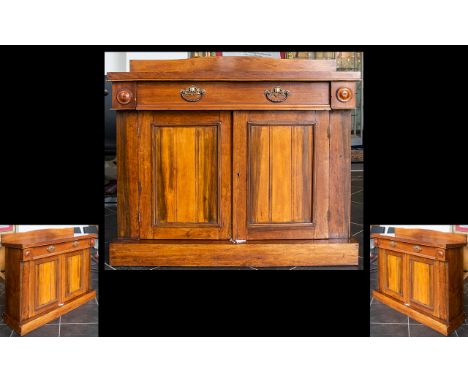 A Victorian Mahogany Chiffonier /Buffet with a single frieze drawer over twin cupboard doors enclosing a single shelf. Raised