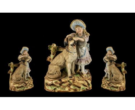 A German Heubach Late 19thC Bisque Figure Group depicting a baby piano girl with a  large dog.