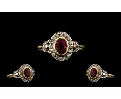 18ct Gold Oval Shaped Diamond and Ruby Set Cluster Ring - of attractive form. The round brilliant cut Diamonds of good colour