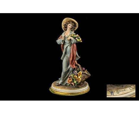 Capo-di-Monte Figure of a Flower Seller, signed B.Merli; the young woman in a light green dress with deep pink shawl and wide