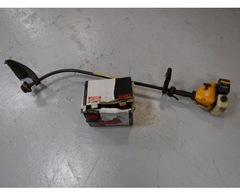 A McCulloch TM250 petrol strimmer, together with a boxed Powerdevil 6" bench grinder 