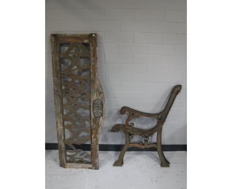 A pair of cast iron bench ends, together with a bench back 