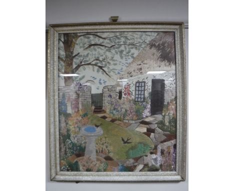 A tapestry framed picture - cottage and garden