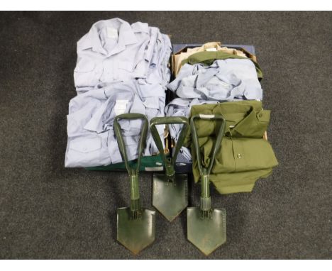 Two boxes containing army surplus shirts, three military shovels, together with two rolled mats 