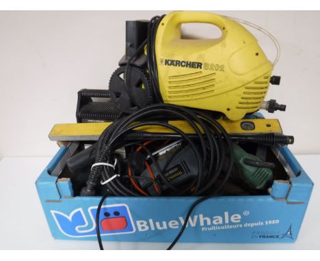 A box containing assorted power tools, two spirit levels, a Karcher B202 pressure washer