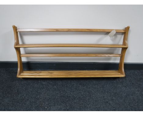 An Ercol elm plate rack 