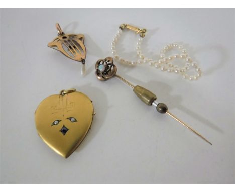 A yellow metal opal and pearl pendant, an opal pin, a pearl set locket and a pearl bracelet with gold clasp