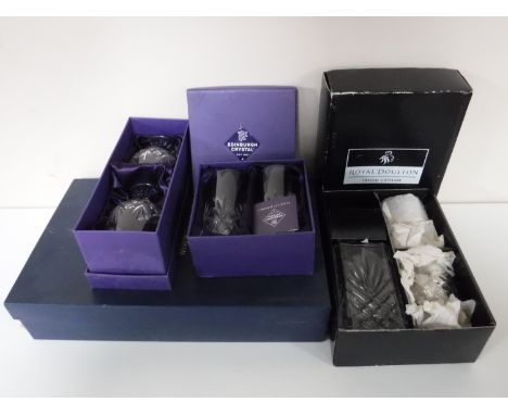 A box of six Rockington Crystal wine glasses (one damaged), a boxed Royal Doulton decanter and glass set, boxed pair of Edinb