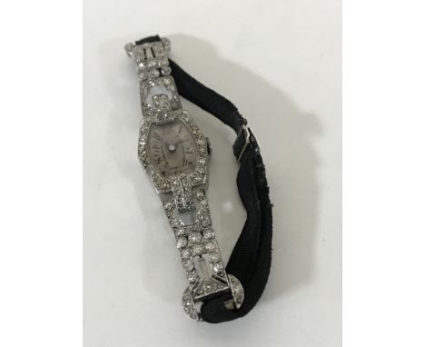 Superb quality Lady's platinum cocktail watch set with approximately 2.5ct diamonds CONDITION REPORT: The watch does not wind