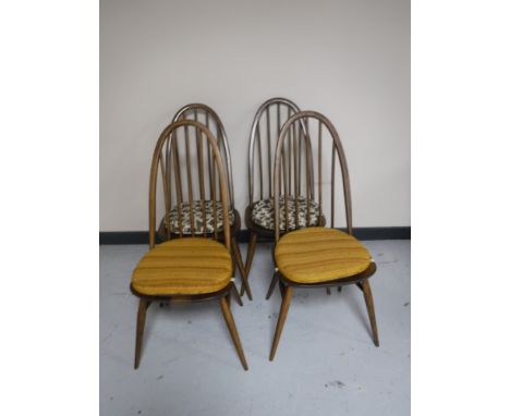 A set of four Ercol high backed dining chairs 